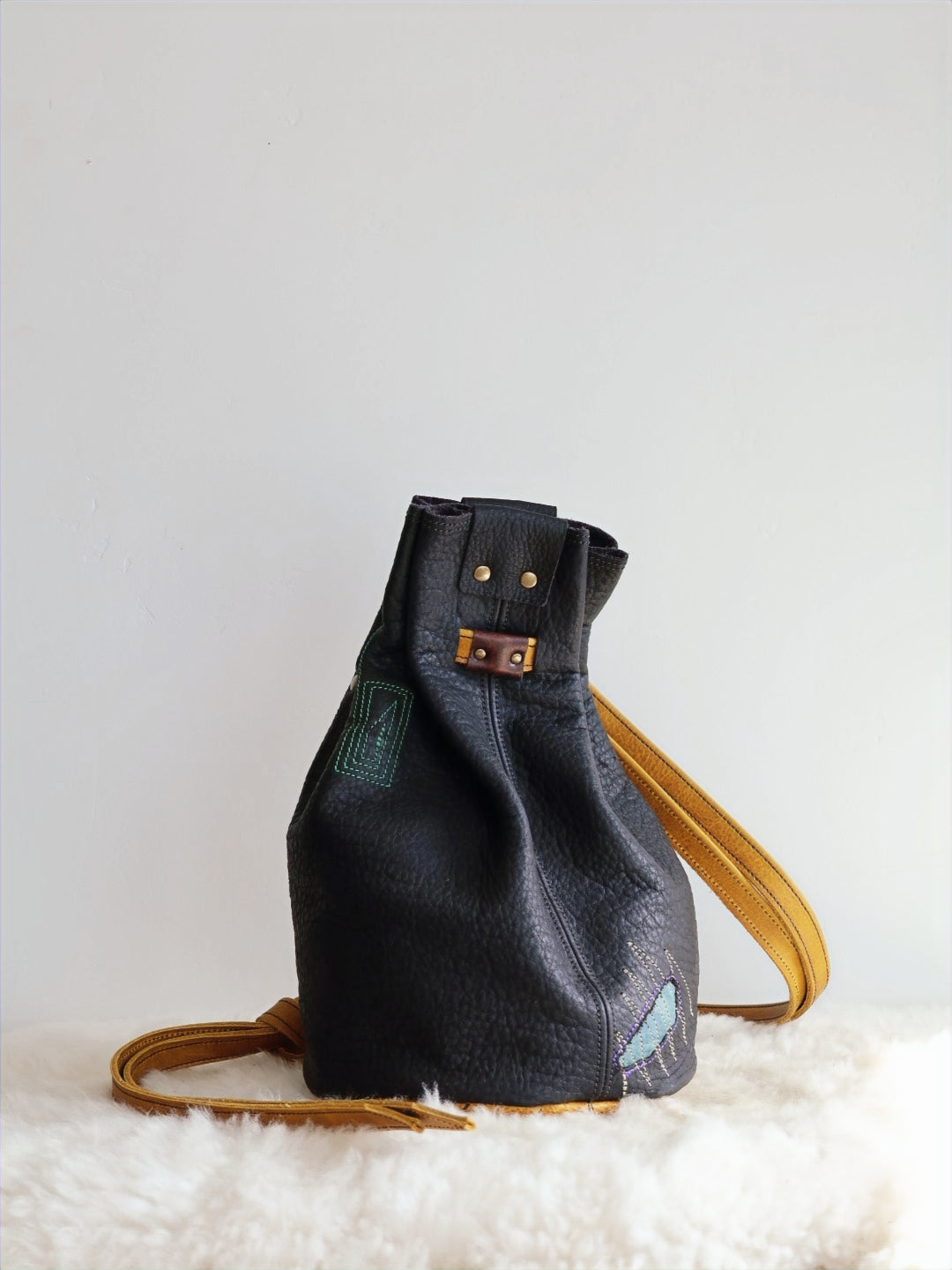 1 of 1 Luna Crossbody Adjustable Cinch Top Leather Backpack | swallowtail black image 0