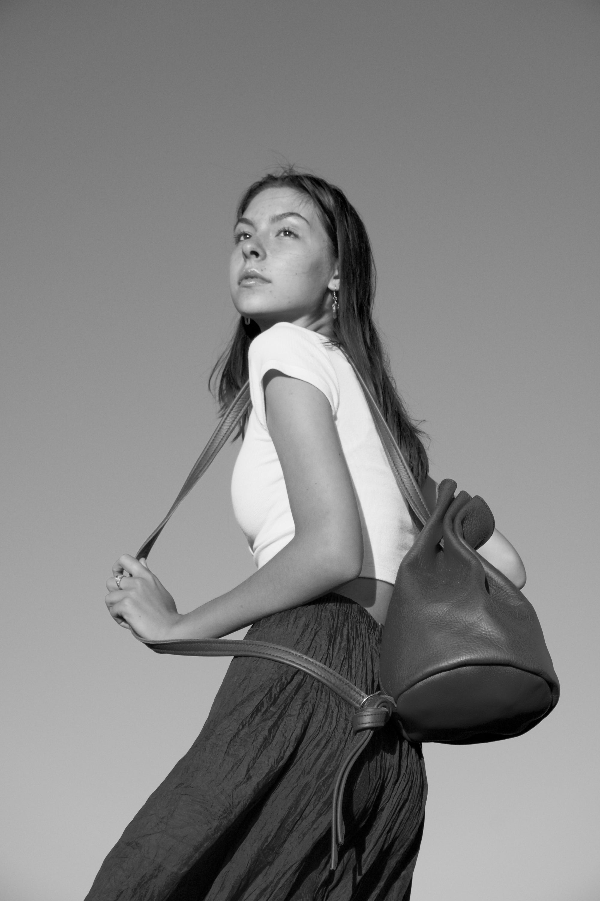 1 of 1 Luna Crossbody Adjustable Cinch Top Leather Backpack | swallowtail black image 6
